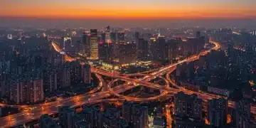 中国现代化城市夜景，高楼林立，高速公路和桥梁交织，象征区域协调发展与一体化进程。
