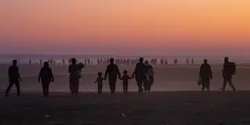 Tracking Global Refugee Movements 2025: US Immigration Challenges Refugees walking towards a new horizon, symbolizing global displacement and hope