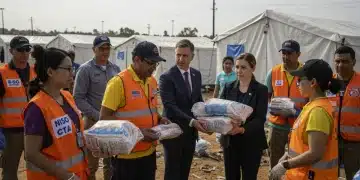 US aid workers and officials provide humanitarian relief in a global crisis zone, 2025.